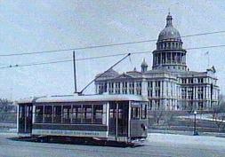 Austin Street Railway Company Trolley passes the Texas State Capital